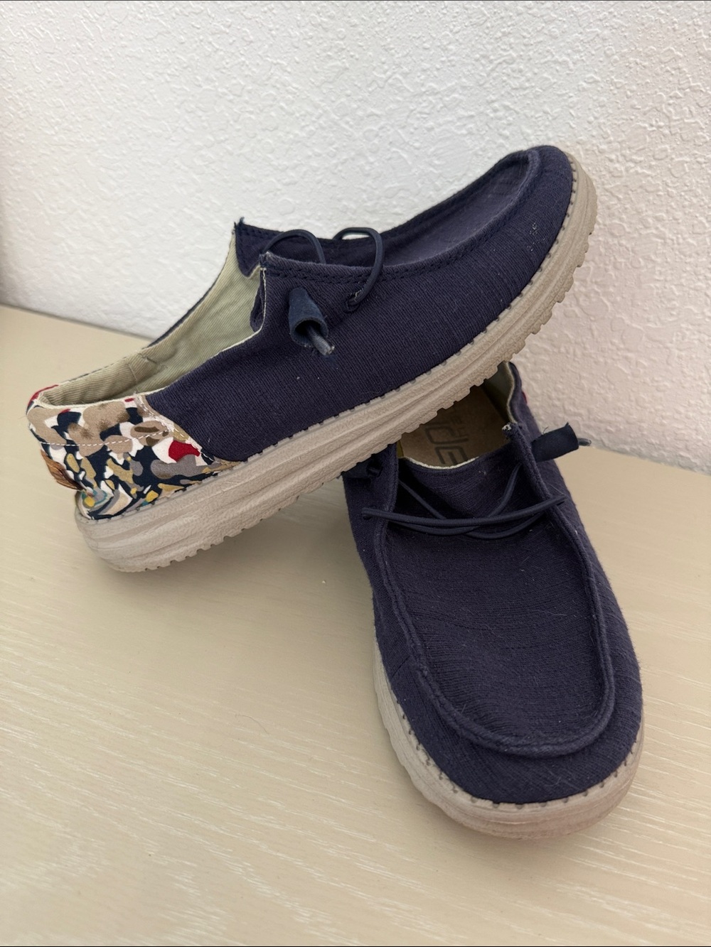 HEY DUDE Women’s Navy Canvas Slip-On Sneakers with Patterned Heel Accent